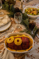 Thanksgiving dinner. Smoked baked ham over a cozy table with Holiday decor