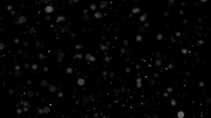 Winter freeze motion of white snow coming down, isolated on black background. Snowfall texture overlays.
