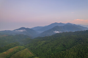 Fototapeta premium Beautiful aerial view of green forest and nature rainy season.