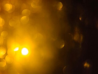 Bokeh background effect The atmosphere is very luxurious and precious. Glittering yellow gold diamonds fell. Contrasts beautifully with the black background.