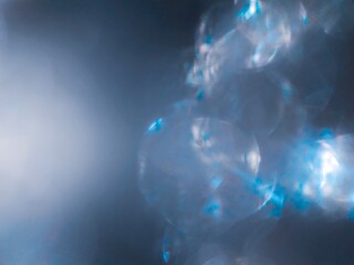 Serene blue tone bokeh background effect The atmosphere is luxurious and precious. Diamonds fall like rain Cuts the background beautifully.