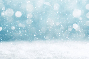 Snowfall with soft blue tones, creating a tranquil winter background with bokeh light effects. Ideal for seasonal banners.