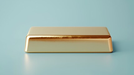 A shiny gold bullion bar resting on a soft blue surface, symbolizing wealth and luxury.