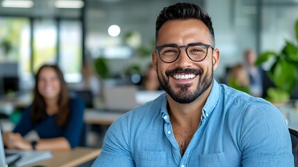 Confident and Smiling Businessman in Modern Office Environment Surrounded by Coworkers and Colleagues during a Business Meeting or Teamwork