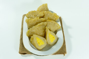 Pempek or mpek-mpek is a delicacy from Palembang, South Sumatra. It is made of fish and sago flours and served together with a dark, rich sauce called cuko. Isolated on white background