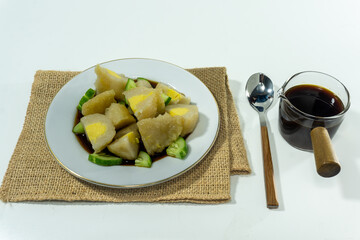 Pempek or mpek-mpek is a delicacy from Palembang, South Sumatra. It is made of fish and sago flours and served together with a dark, rich sauce called cuko.