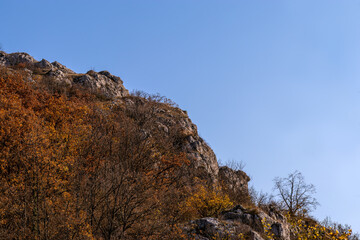 Steep rocky slope in mountainous area. Autumn landscape, diagonal arrangement. Mountainous terrain, autumn, october. Crimea.