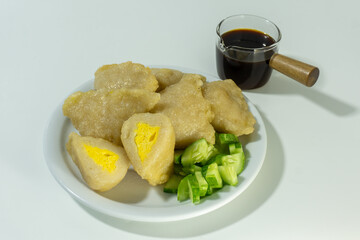 Pempek or mpek-mpek is a delicacy from Palembang, South Sumatra. It is made of fish and sago flours and served together with a dark, rich sauce called cuko.