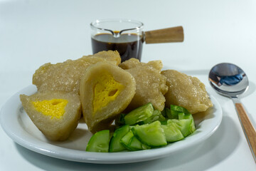 Pempek or mpek-mpek is a delicacy from Palembang, South Sumatra. It is made of fish and sago flours and served together with a dark, rich sauce called cuko.