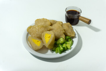 Pempek or mpek-mpek is a delicacy from Palembang, South Sumatra. It is made of fish and sago flours and served together with a dark, rich sauce called cuko.