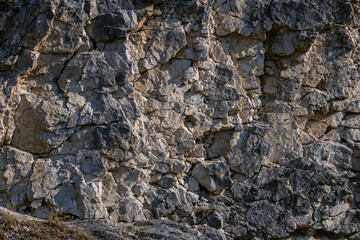Close-up of mountain slope. Realistic background created by nature itself. Close-up of destruction, evolution of rock formation. Crimea.
