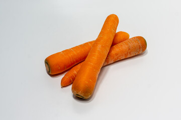 Carrots isolated. Carrot on white background. Three carrots. Full depth of field.