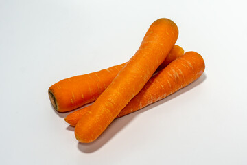 Carrots isolated. Carrot on white background. Three carrots. Full depth of field.