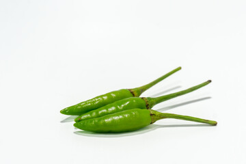 spicy green cayenne pepper isolated on white background. Chili padi, small pepper. Cabe rawit hijau...