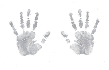 Colorful handprints and fingerprints create an abstract, artistic pattern