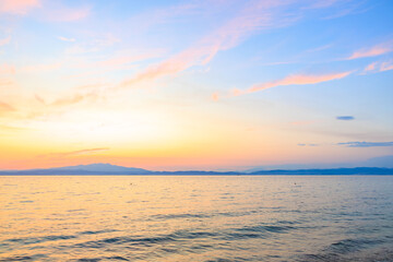 The sky is a beautiful shade of pink and orange