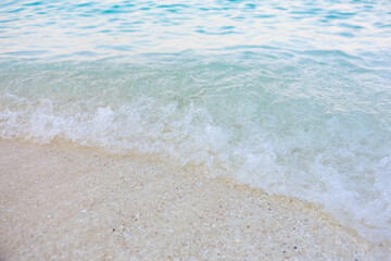The ocean is calm and the water is a beautiful shade of blue