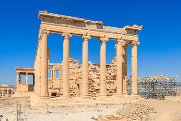The building is old and has a lot of columns, Acropolis in Athens
