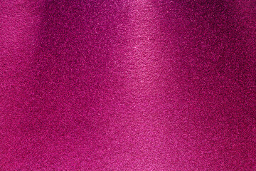 A pink background with a purple and gold glittery texture