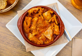 National Spanish dish Callos a la Gallega - thick broth with stewed tripe, vegetables and chilli pepper