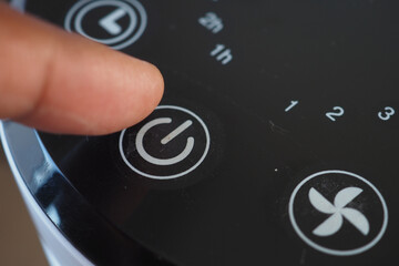 Gently pressing the power button on your electronic device is a convenient and stylish action