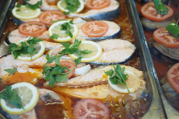 Enjoy a delicious baked fish with fresh herbs and vibrant vegetables for a delightful meal