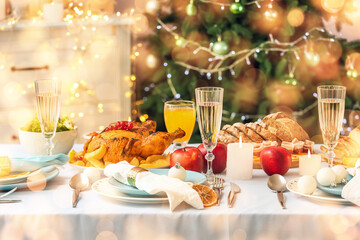 Tasty dishes and drinks for Christmas dinner on table