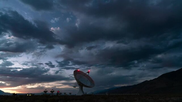 Timelapse day to night transition of parabolic dish at Owens Valley Radio Observatory in Eastern Sierra, California