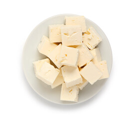 Plate with delicious cut feta cheese on white background