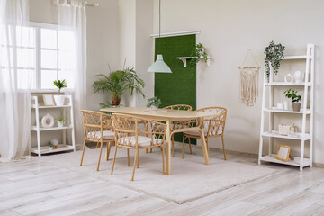 Interior of stylish modern dining room with table and chairs