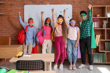 Pupils dressed as superheroes in classroom