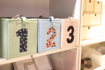 Numbered kiddie boxes in a cozy room