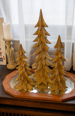 Full frame texture background of a small side table decorated with an assortment of various vintage Christmas tree figurines and ornaments