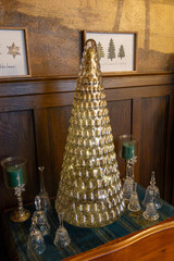 Full frame texture background of a small side table decorated with an assortment of various vintage Christmas tree figurines and ornaments