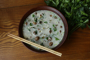 Delicious homemade cheese soup with mushrooms and parsley.