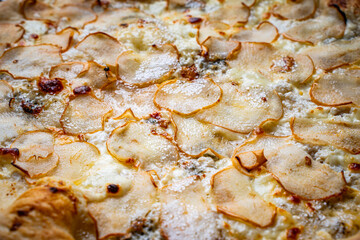 Pizza with pear and garaganzola cheese and mozzarella close-up. Background. High quality photo