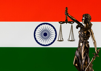 The figure of Themis against the background of the flag of the Republic of India 