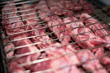 Raw meat being ready to get cooked in grill