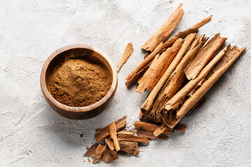 Cinnamon Sticks and Powder on White Background