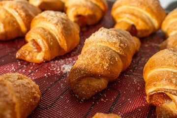 Croissants or bagels with jam on the production floor. Mini bakery, sweet pastries. High quality photo