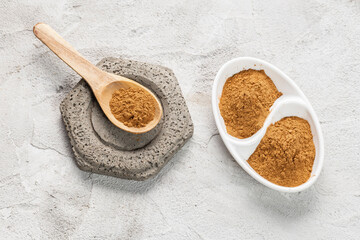 Cinnamon Sticks and Powder on White Background