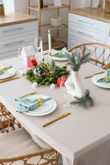 Beautiful festive table setting for Christmas celebration in dining room