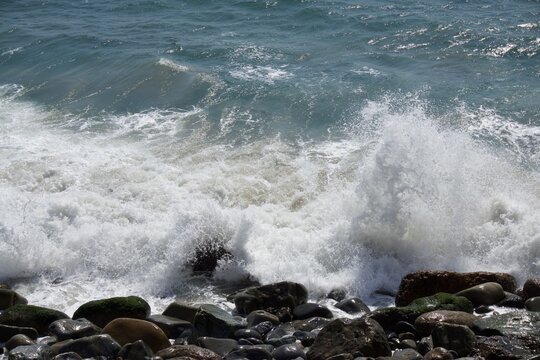 Waves Breaking on the Rocky Shore in Malibu