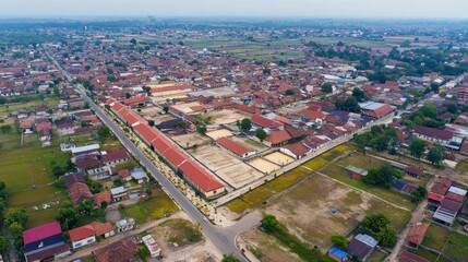 Aerial view of a suburban area with residential buildings and open spaces.