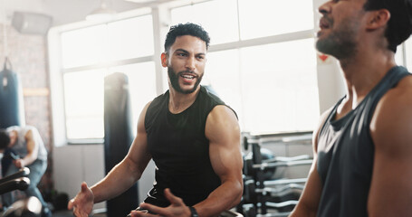 Exercise bike, fitness and motivation with men in gym together for break from cardio training or...