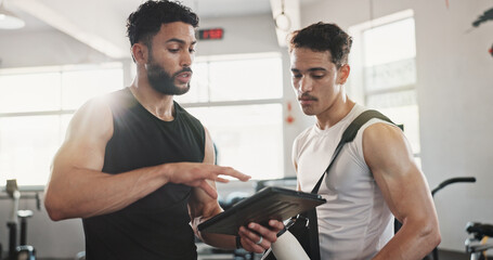 Fitness, advice and men in gym with tablet for online registration, planning or workout schedule....