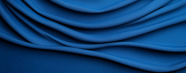 Obraz premium A rich deep blue textured background with a weathered effect. The image features varying shades of navy and electric blue ,dimension, silk,satin, fabric . 