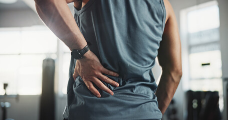Man, hands and back pain with injury at gym for muscle tension, workout accident or sprain....