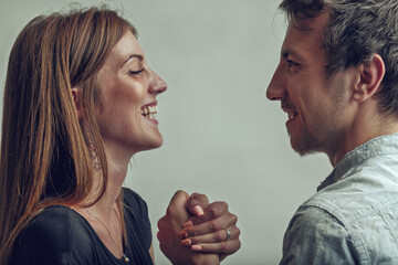 Friendly challenge shown through confident, playful smiles