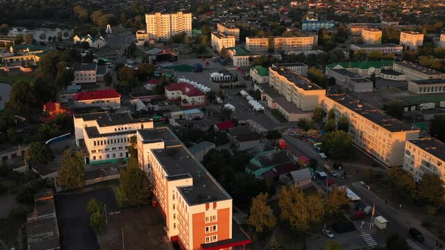 An aerial view shows a charming residential area at sunset, highlighting the communitys beauty. Belarus, Dobrush town